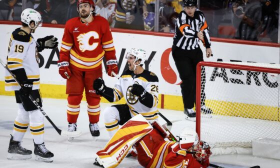 Marc McLaughlin (center) made it two goals in two nights, tying Tuesday's game in Calgary in the third period when he nosed the puck around Flames goalie Dustin Wolf.