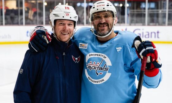 Nicklas Backstrom assists Alex Ovechkin on the ice as he recovers from fractured fibula