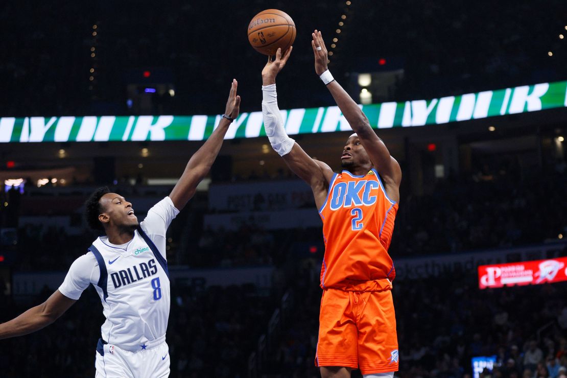 Oklahoma City Thunder guard Shai Gilgeous-Alexander shoots a three against the Dallas Mavericks.