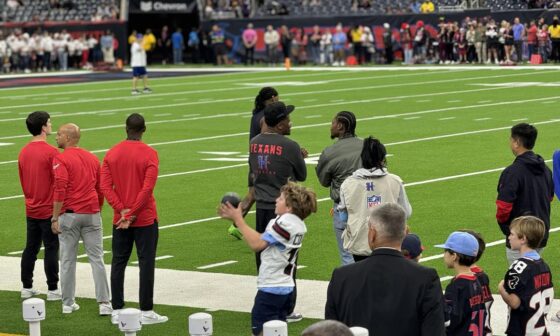 Andre Johnson w diggs at last game. Cal and Hannah reading my tank dell signs.