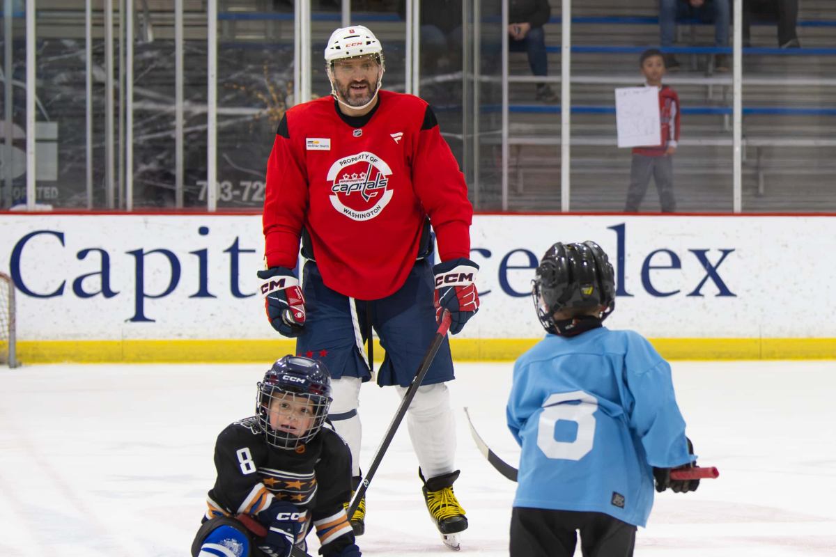 Sergei and Ilya Ovechkin take part in Capitals family skate with their Dad ahead of holiday break