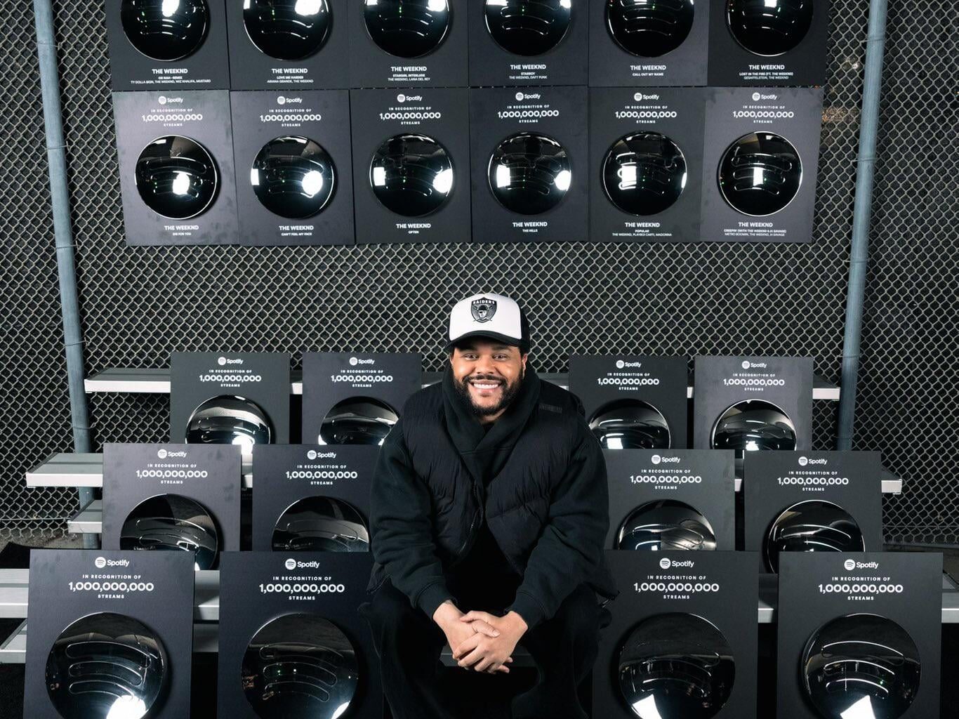 The Weeknd repping the shield posing with his Spotify Plaques