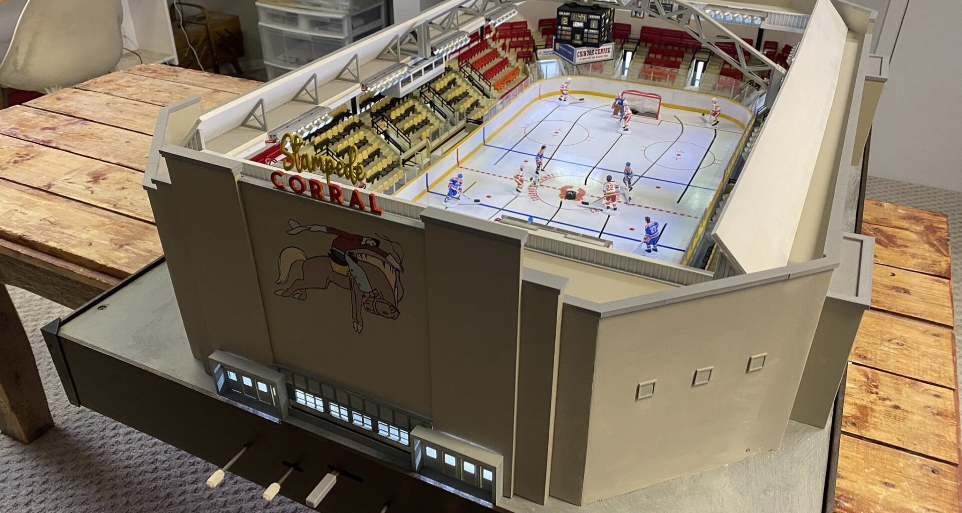 [Old Time Table Hockey] "This is my Stampede Corral table hockey game, classic Flames vs. Oilers, 100% custom built and fully playable. It features plenty of little details for anyone who may have spent any time there."