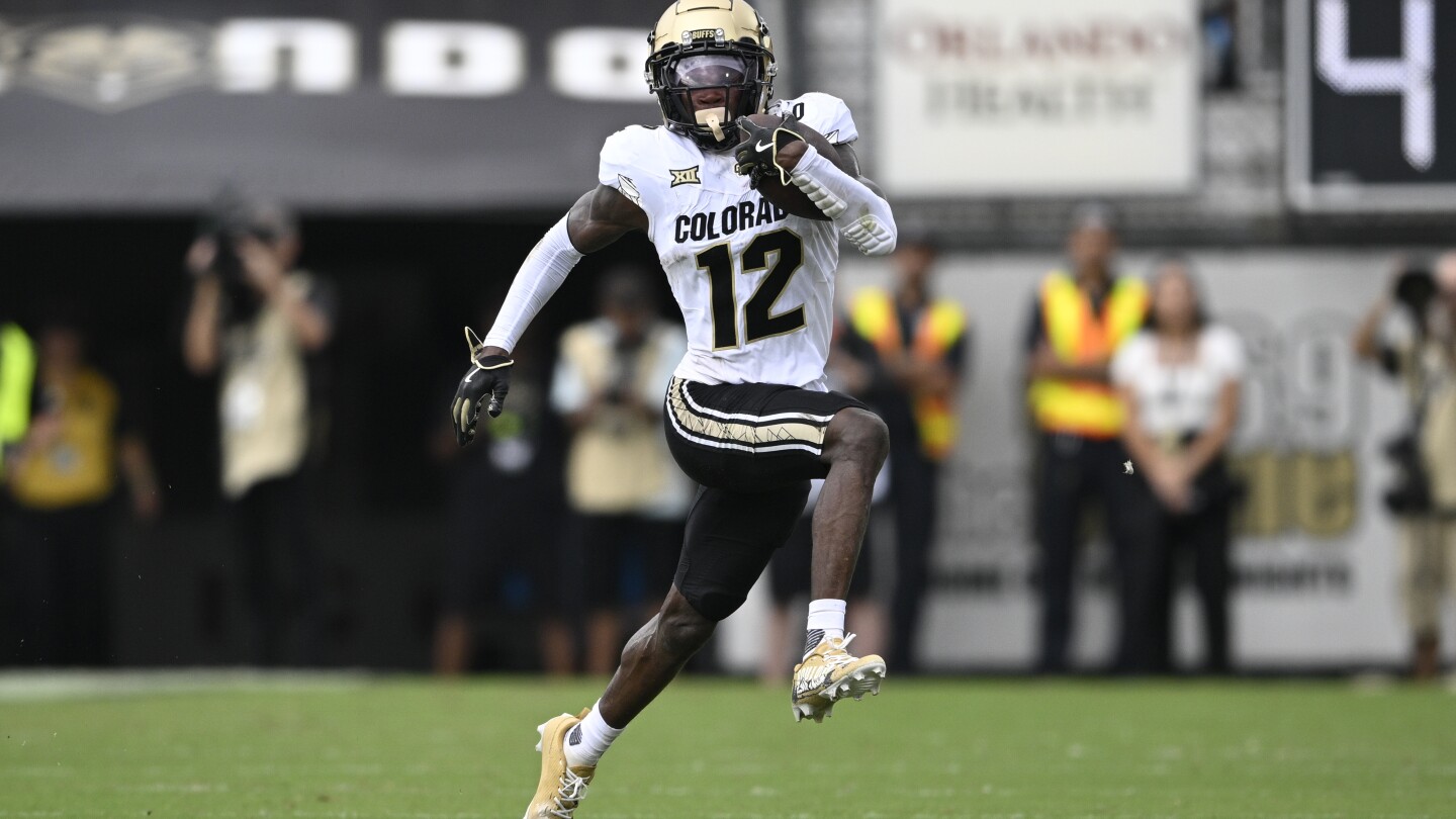 Travis Hunter, the 2-way standout for Colorado, is the AP college football player of the year