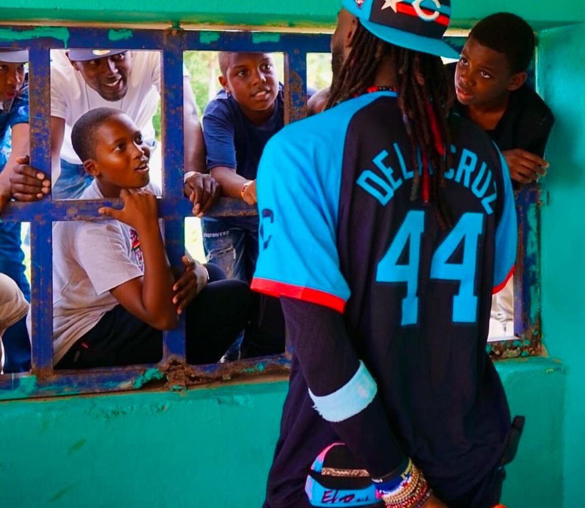 Elly de la Cruz with kiddos in exhibition game