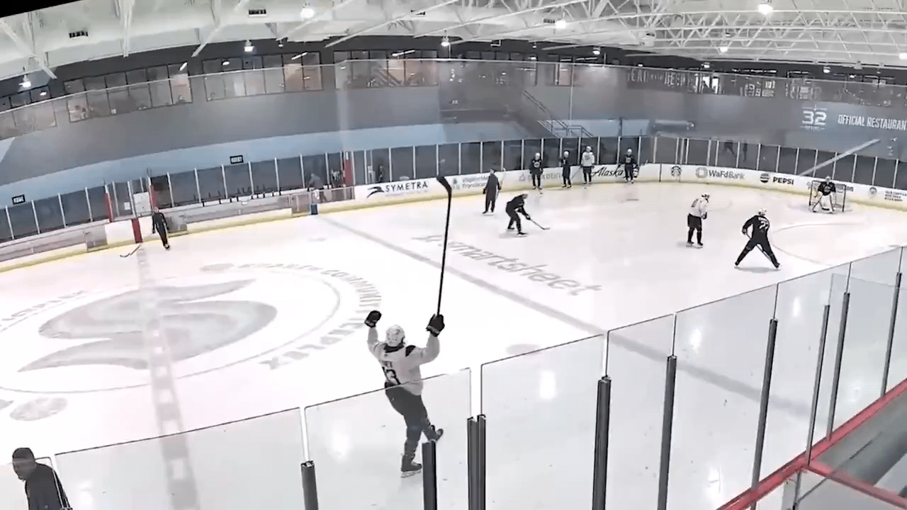 Kraken forward Oliver Bjorkstrand shatters the glass during practice