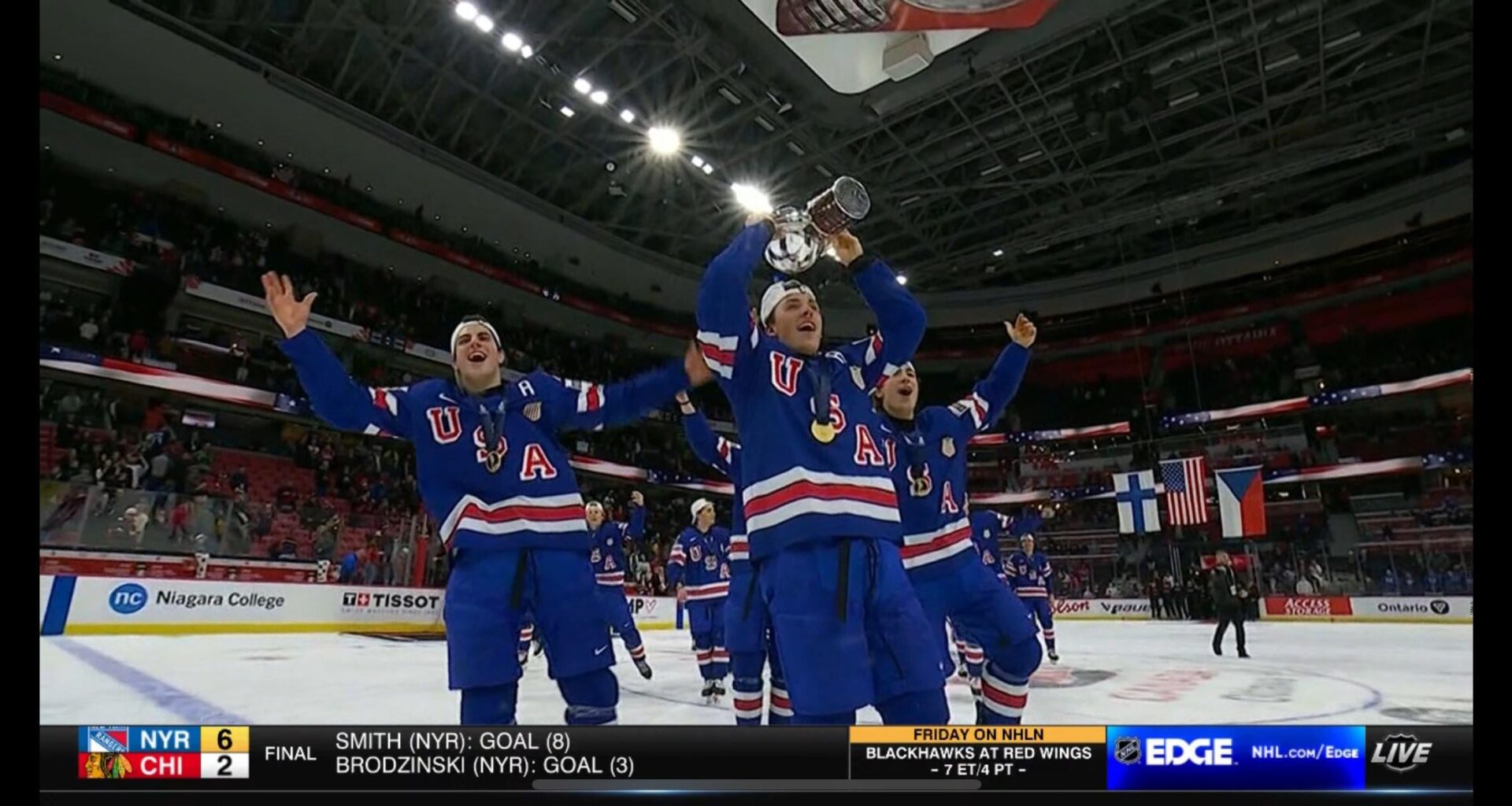 Gabe Perreault and team USA lifting their World Junior Championship cup.